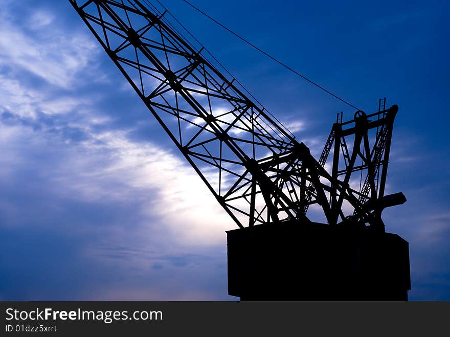 Shipyrd crane silhouette at sunset. Shipyrd crane silhouette at sunset