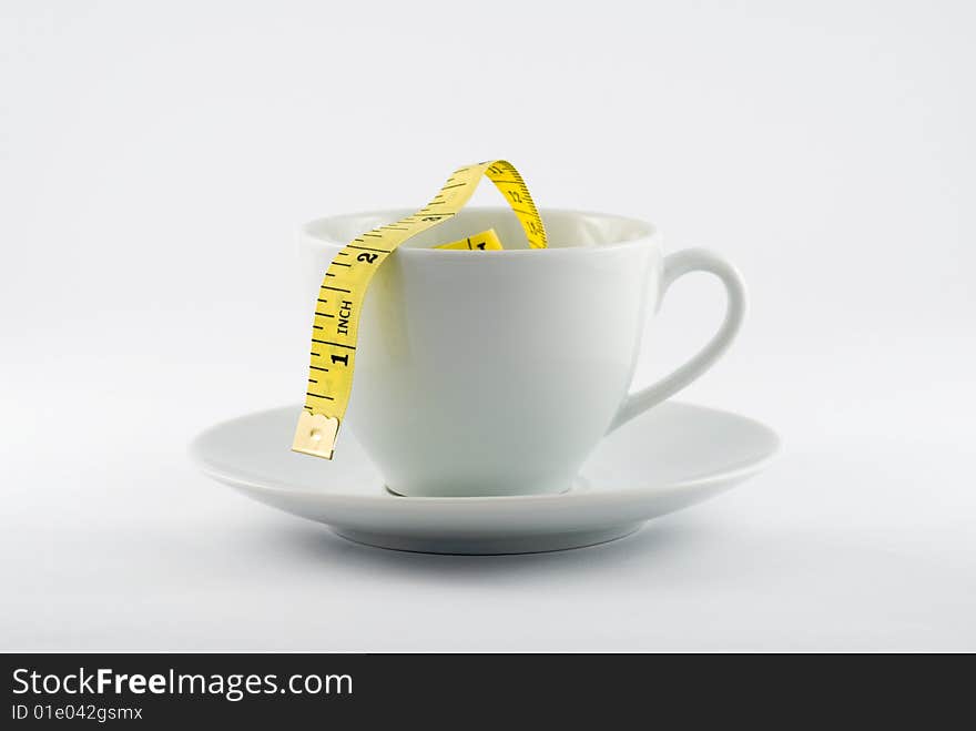 Coffee Cup with yellow tape measure