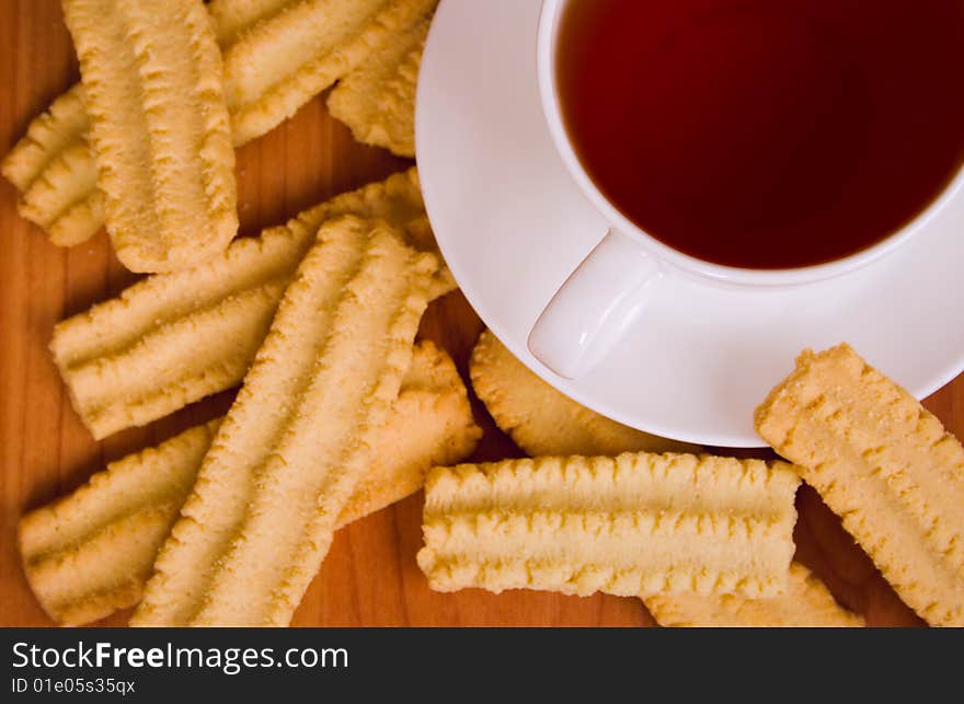 Cup of black tea and cookies