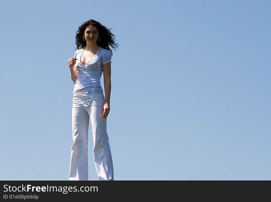 Young woman on a green meadow