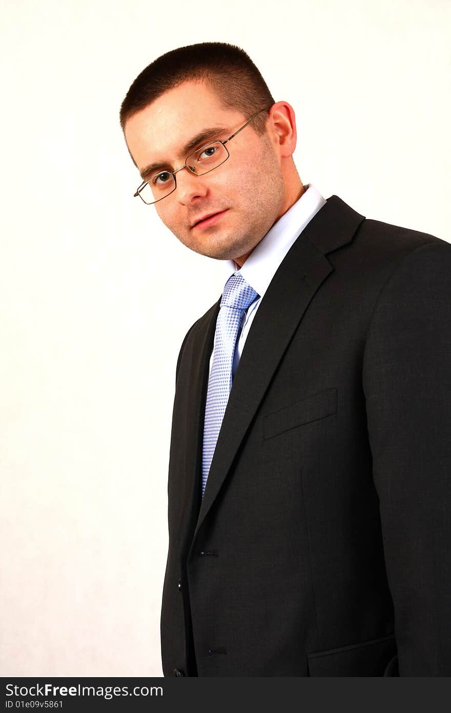 Young businessman on isolated background smiling