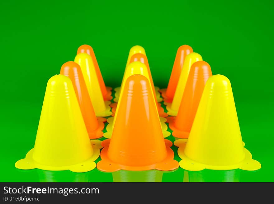 Witches hats isolated against a green background