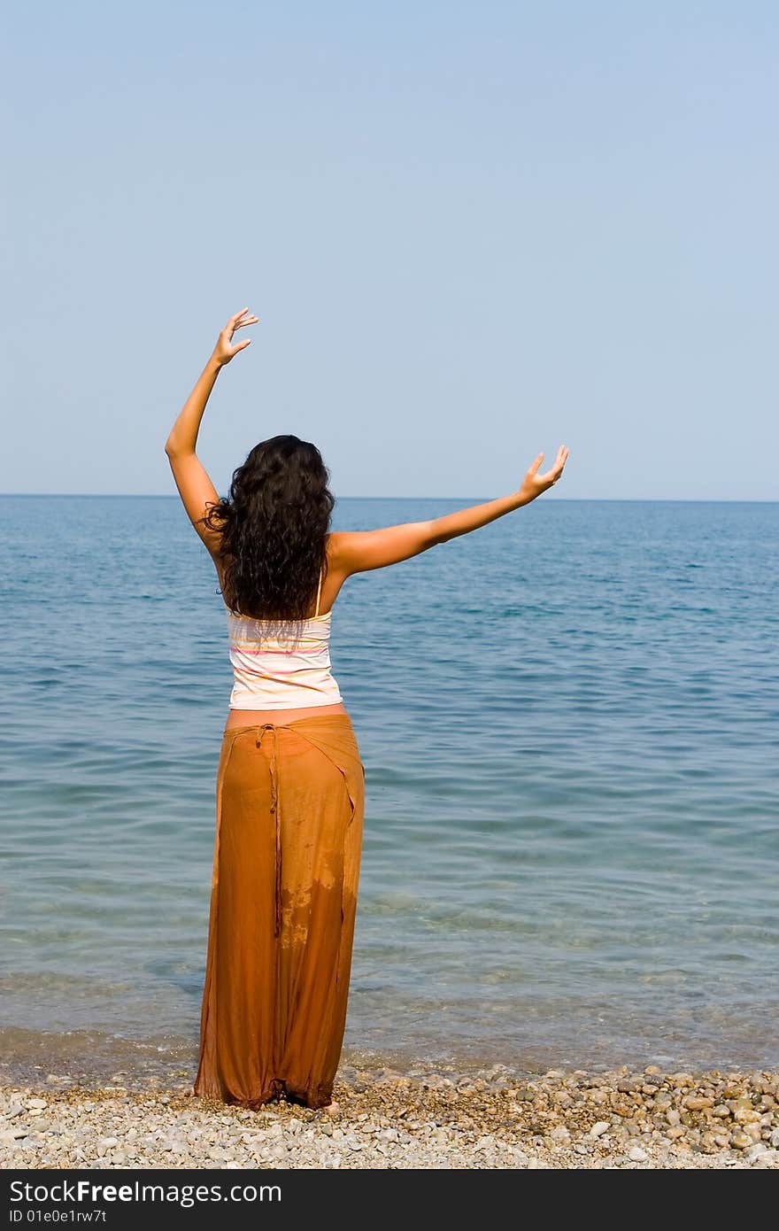 Happy young woman dance on the beach. Happy young woman dance on the beach