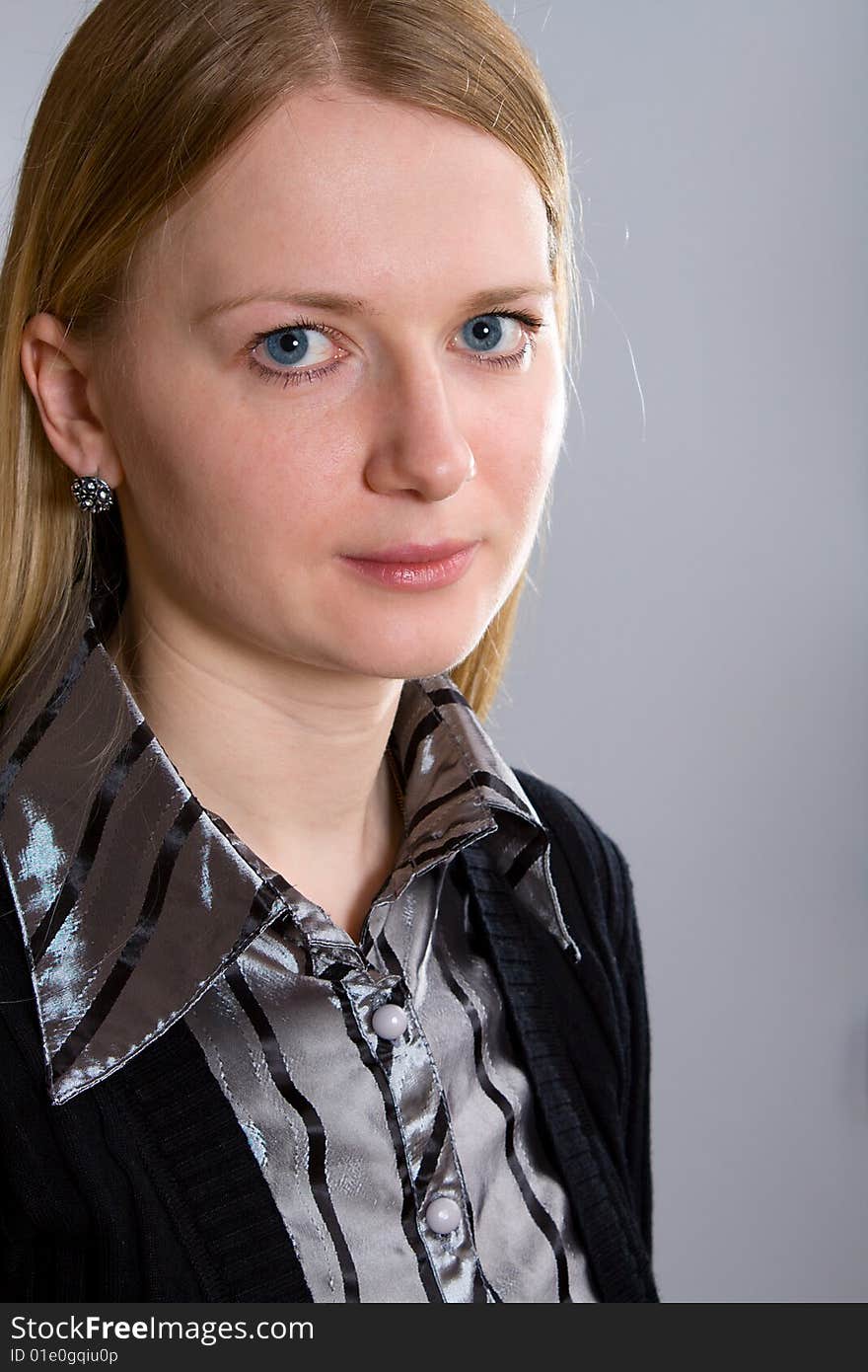 Portrait of young woman on gray background