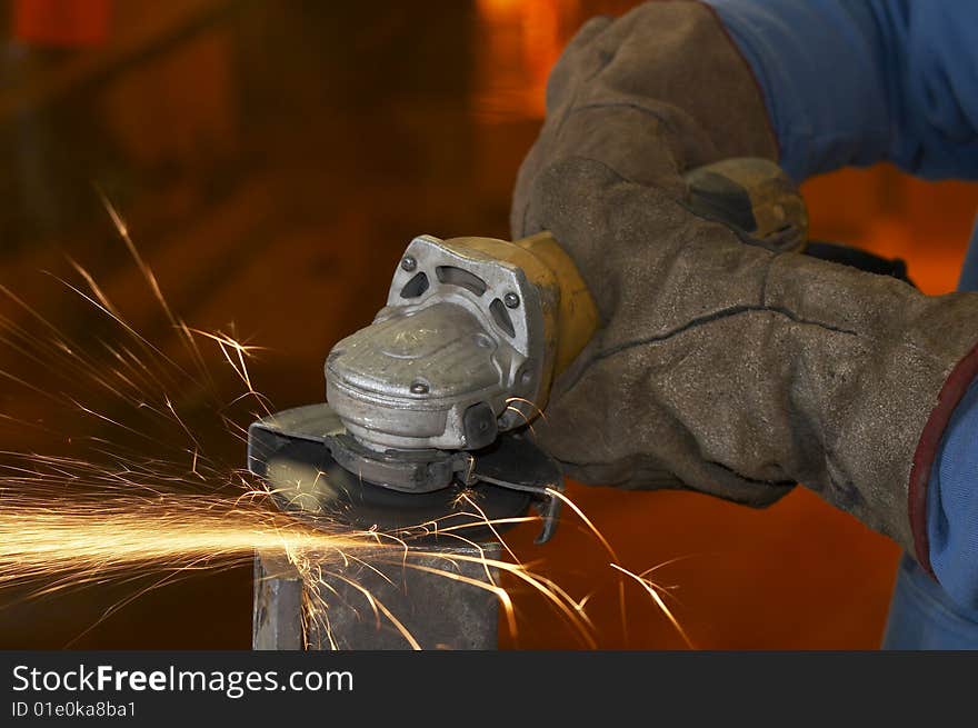 A close picture of a sparks on grinded steel. A close picture of a sparks on grinded steel