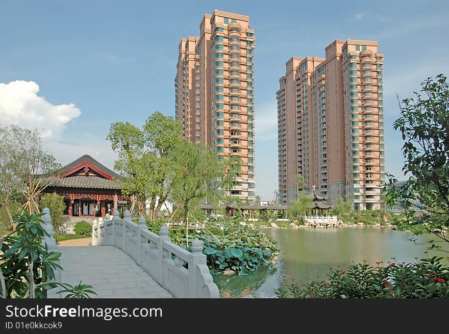 There are two upscale apartment block by the lakeside,a stone bridge leads to the pavilion of apartment community garden