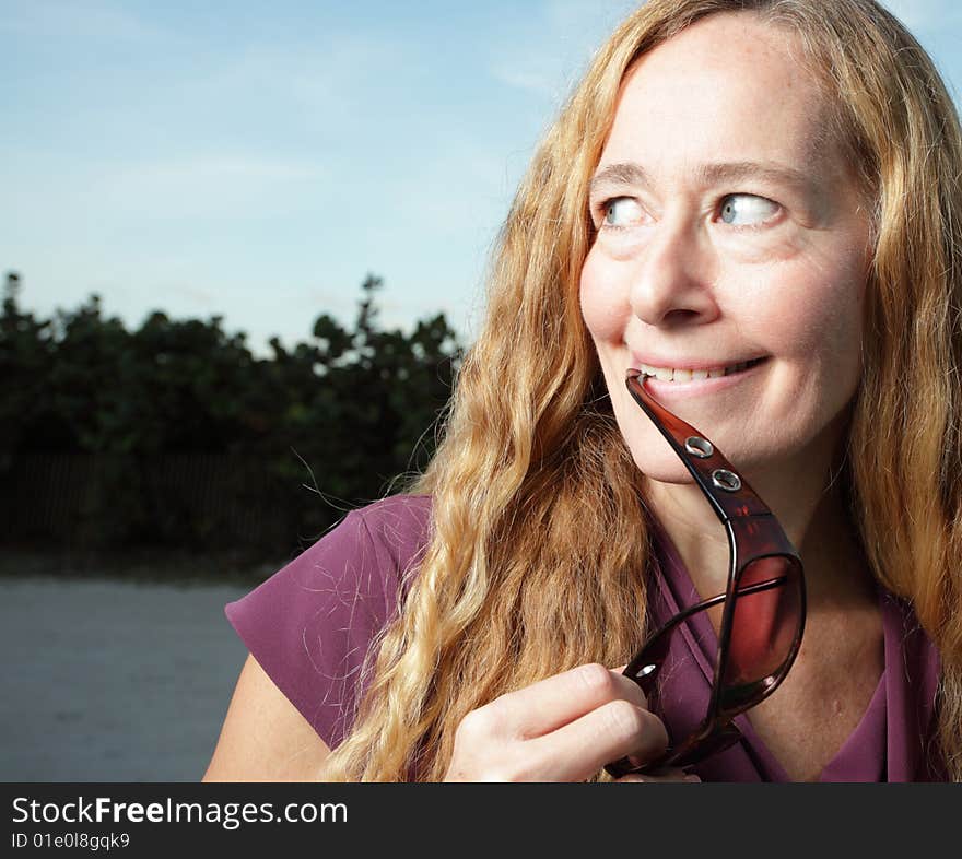 Mature adult smiling and looking sideways. Mature adult smiling and looking sideways