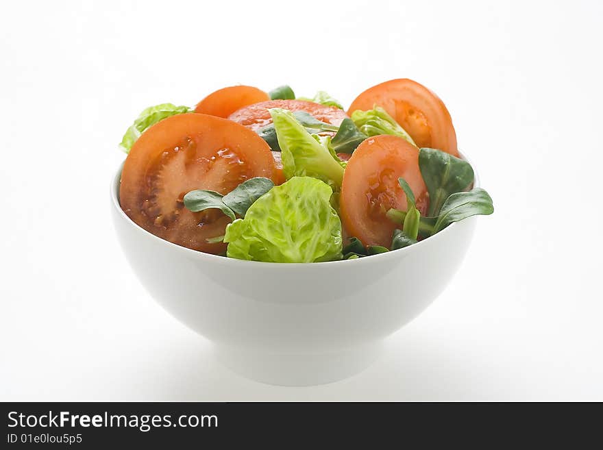 Fresh natural salad bowl tomato lettuce onion oil vinegar