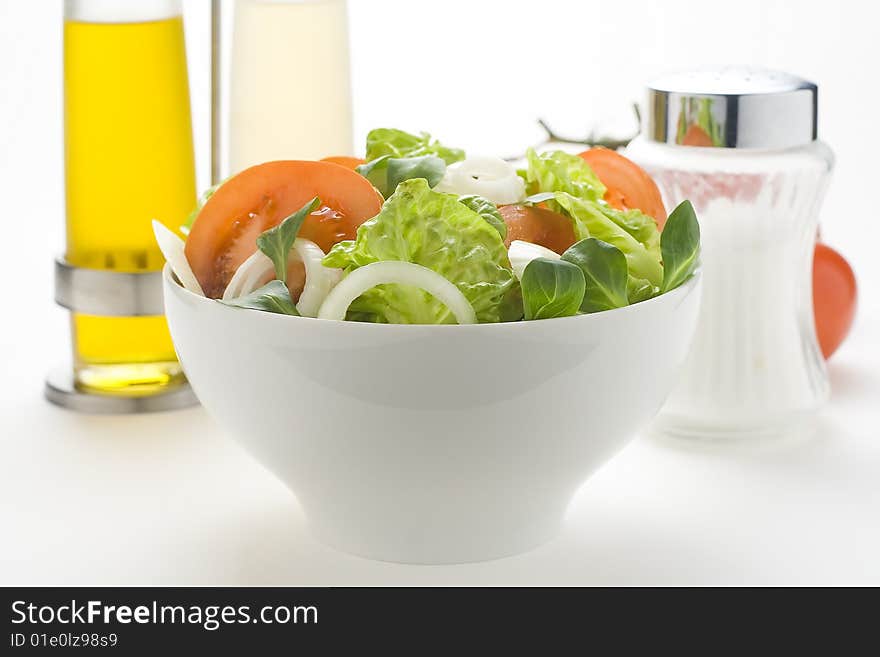 Fresh natural salad bowl tomato lettuce onion oil vinegar