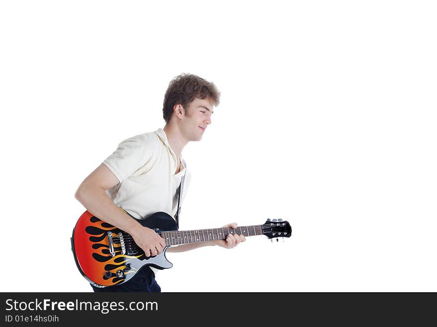 Young man playing guitar isolated over white. Young man playing guitar isolated over white