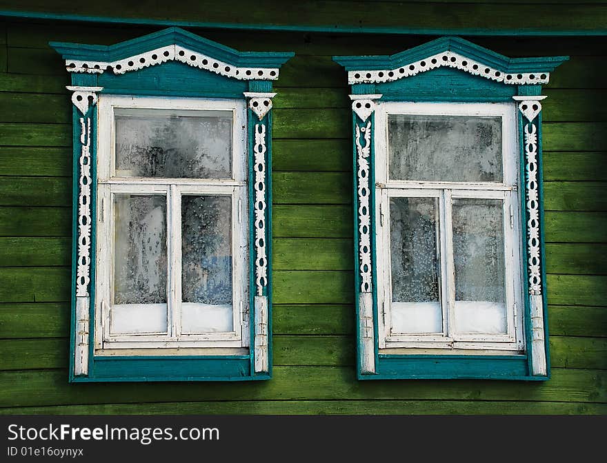 House window in the Russian village, decorated with a carving. House window in the Russian village, decorated with a carving.