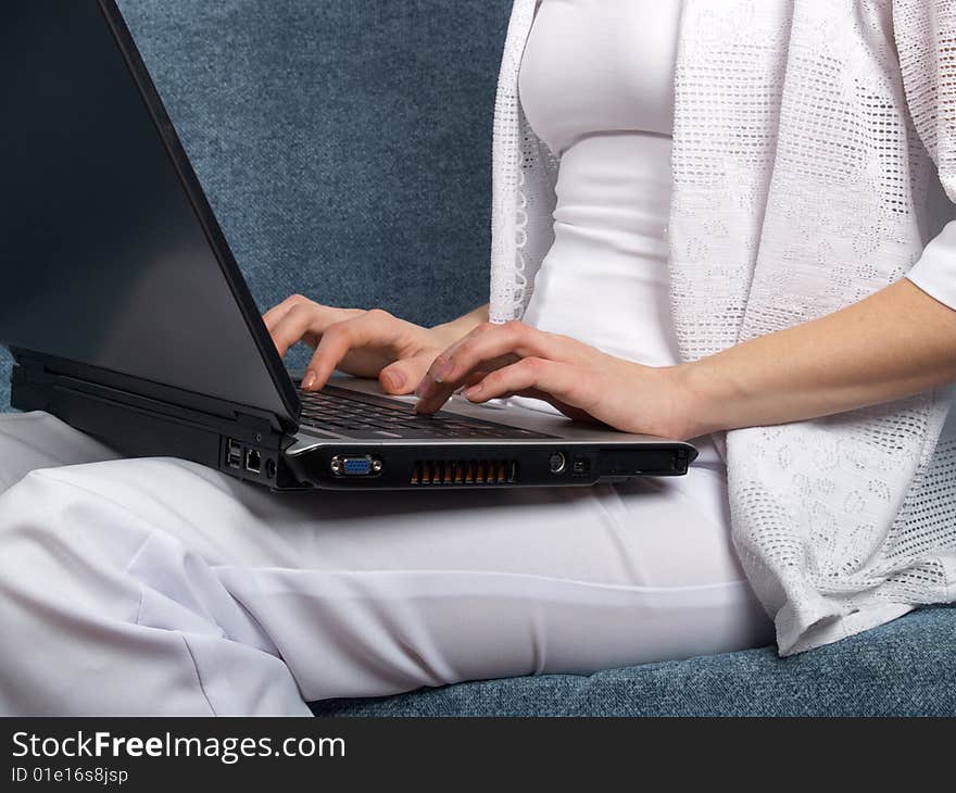 Laptop in a lap at the girl