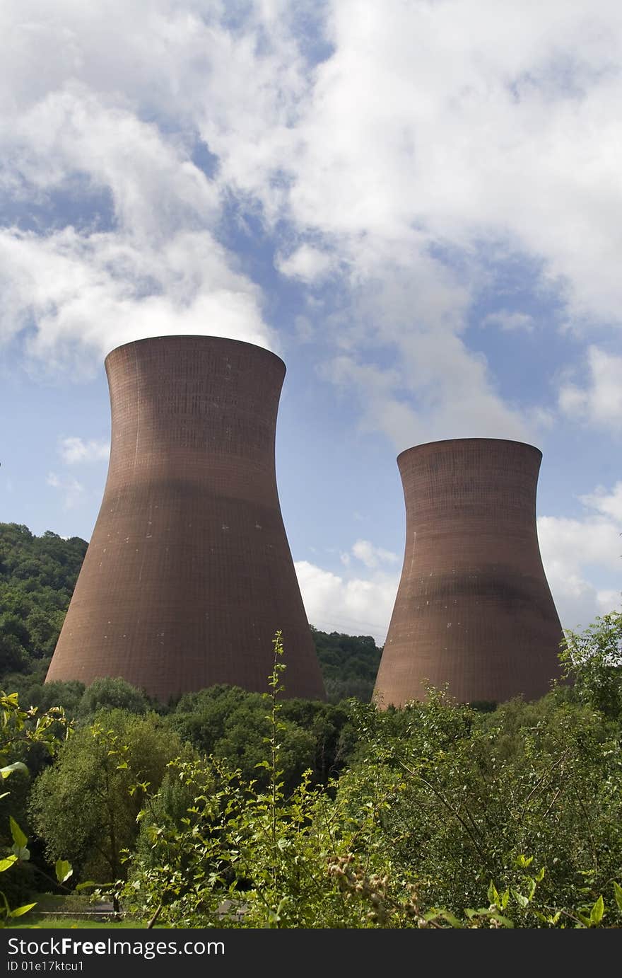 The three cooling towers of the coal-fired Ironbridge power station rise above the greenery of the surrounding gorge, close to where the industrial revolution began. The three cooling towers of the coal-fired Ironbridge power station rise above the greenery of the surrounding gorge, close to where the industrial revolution began.