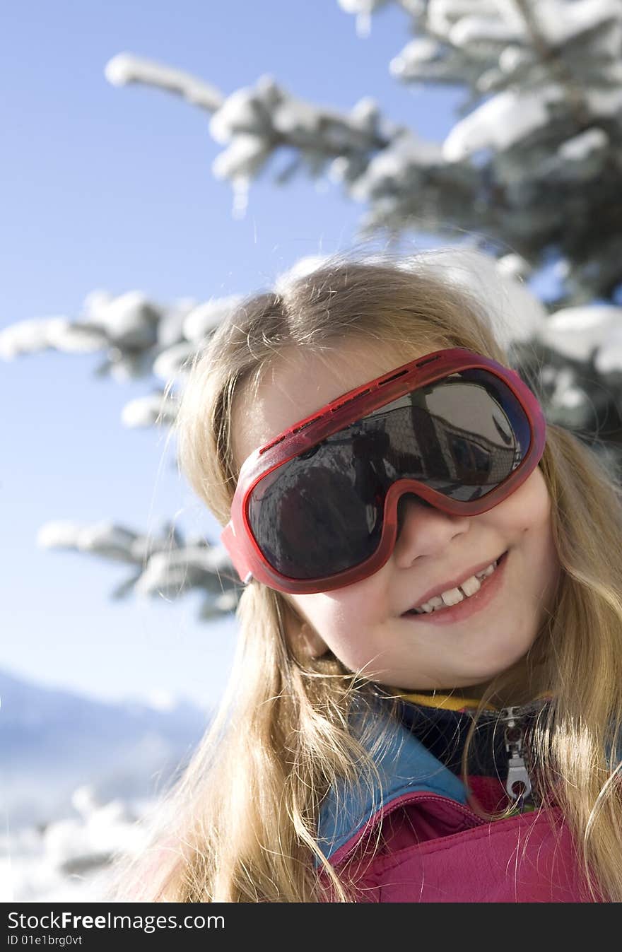 Happy girl on the background of the mountains