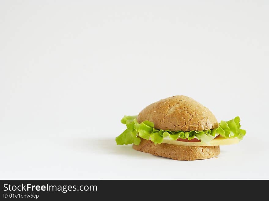 Sandwich with tomato, cheese and salad on white background. Sandwich with tomato, cheese and salad on white background