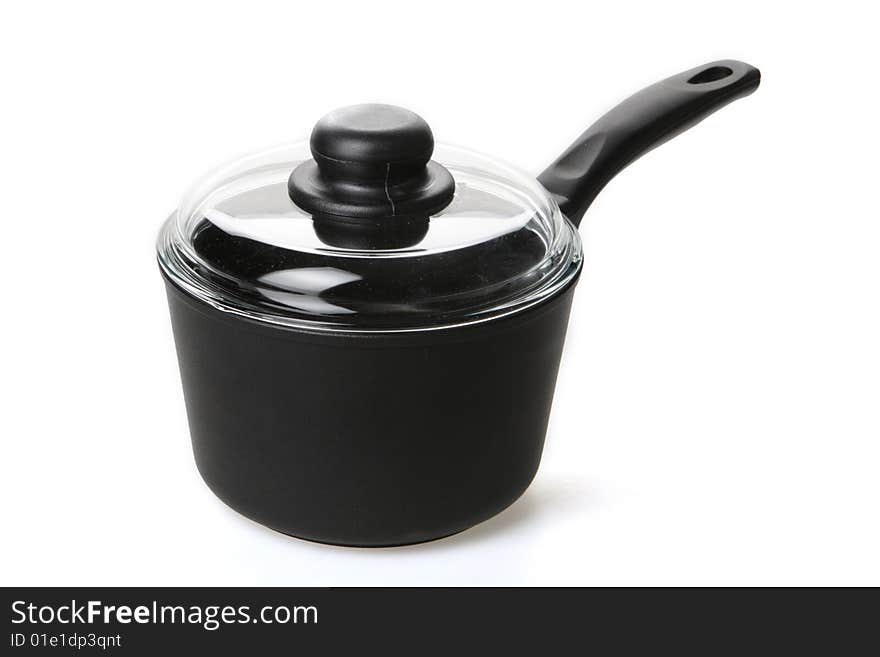 Metal teflon ladle with a glass cover on a white background