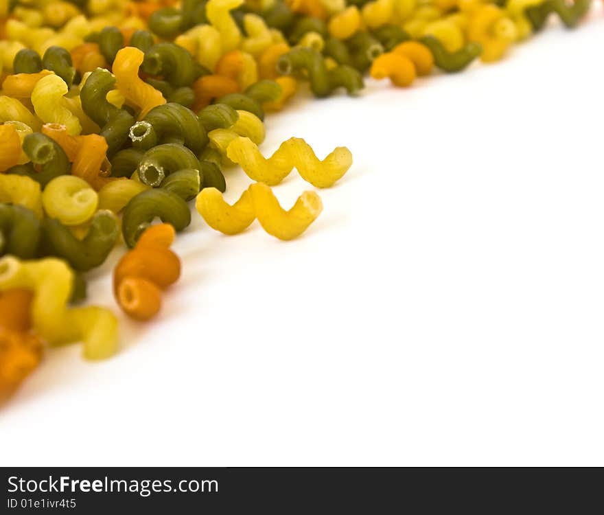 Colorful noodles frame on a white background. Soft focus. Colorful noodles frame on a white background. Soft focus