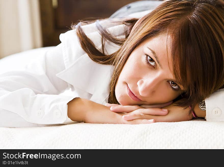 Businesswoman posing over white sheets. Businesswoman posing over white sheets