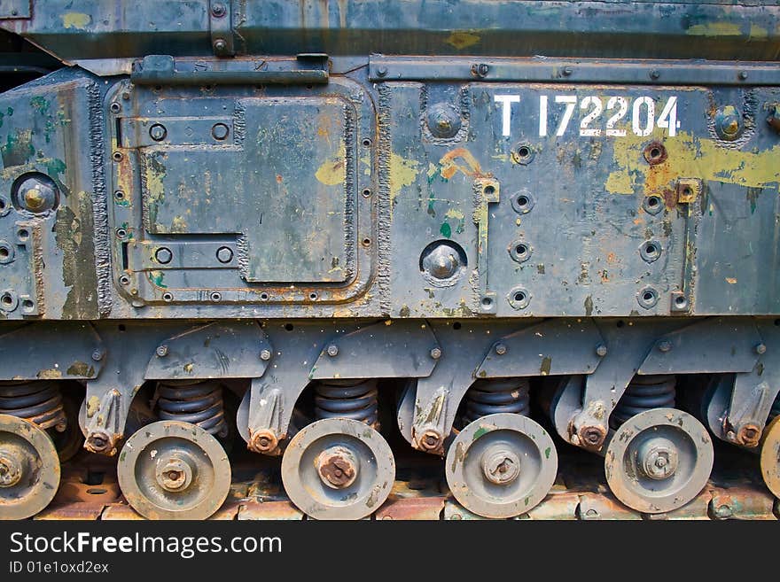 The side of an old, rusted, second world war tank, nice colors, beautiful texture