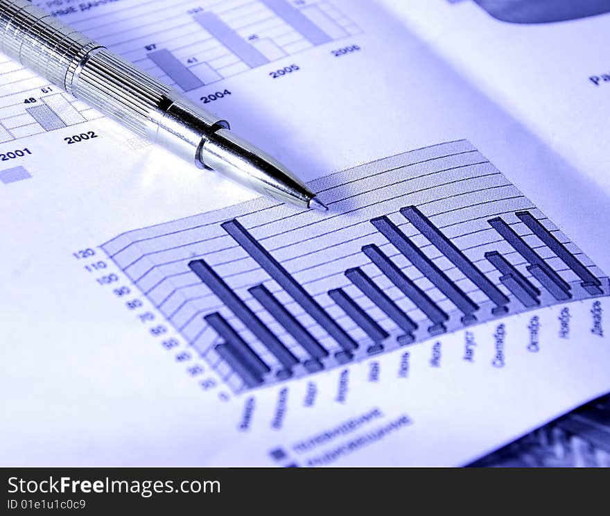 Calculator, fountain pen, glasses and stock chart. Calculator, fountain pen, glasses and stock chart