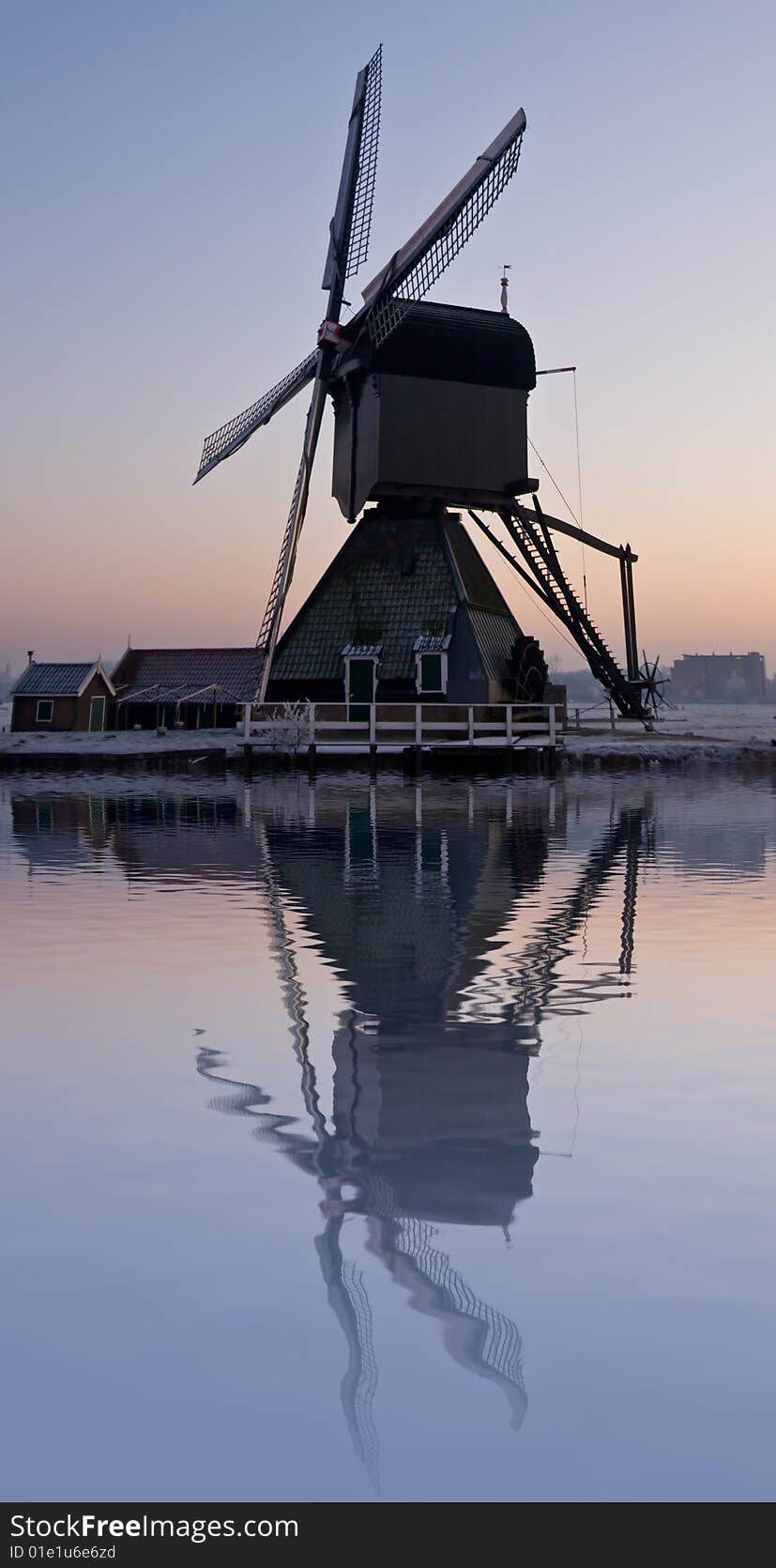 Dutch windmill with reflection in the water