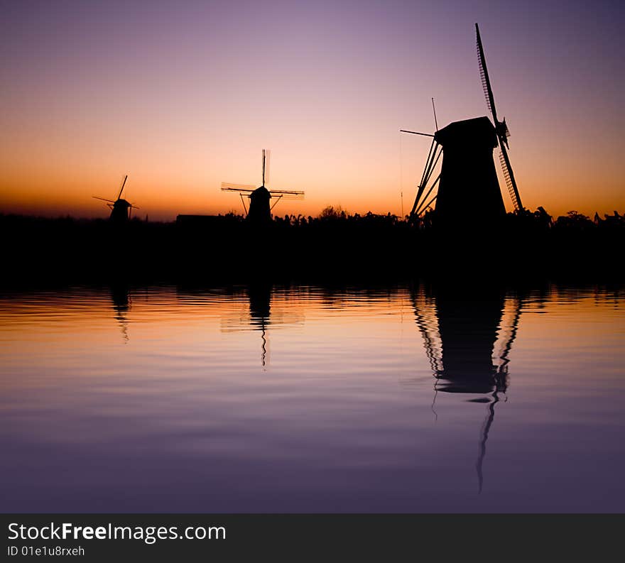 Dutch windmill with reflection in the water