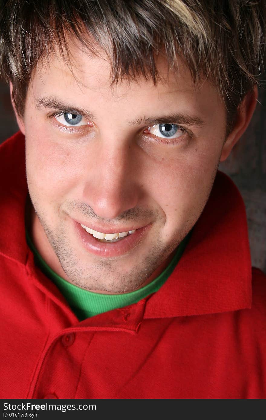 Male model against a rough brick wall background