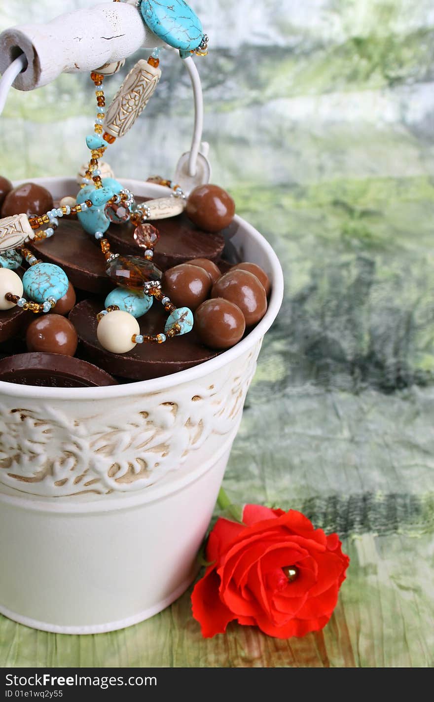 Bucket filled with sweets and blue beading. Bucket filled with sweets and blue beading