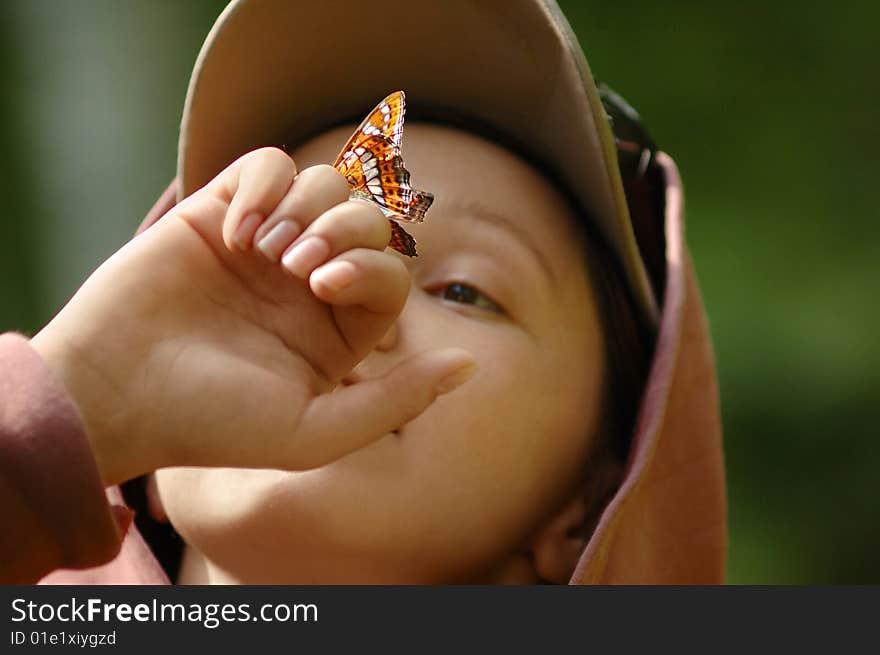 Picture of a happy girl with a butterfly