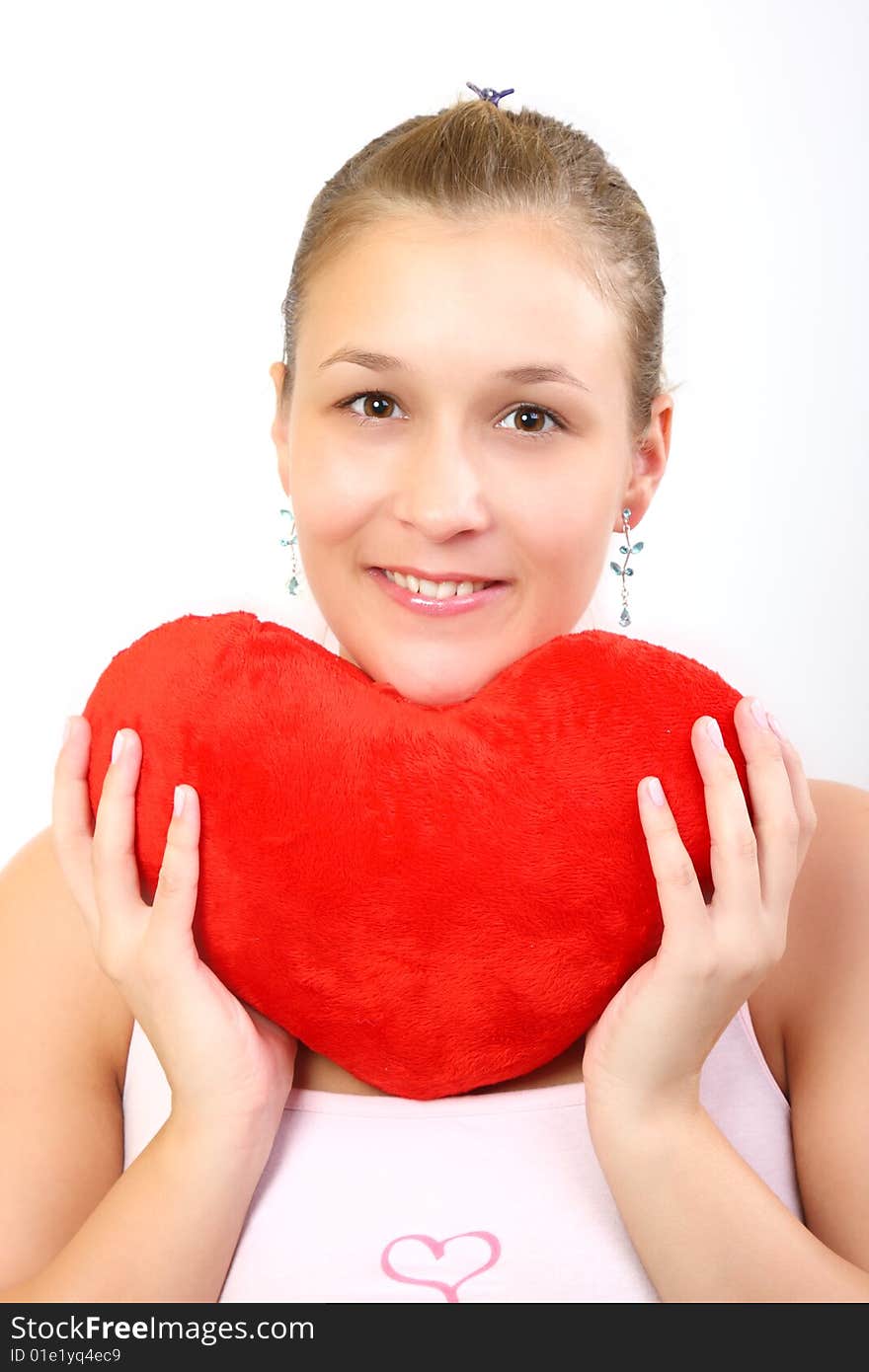 Girl holding a plush heart. Girl holding a plush heart