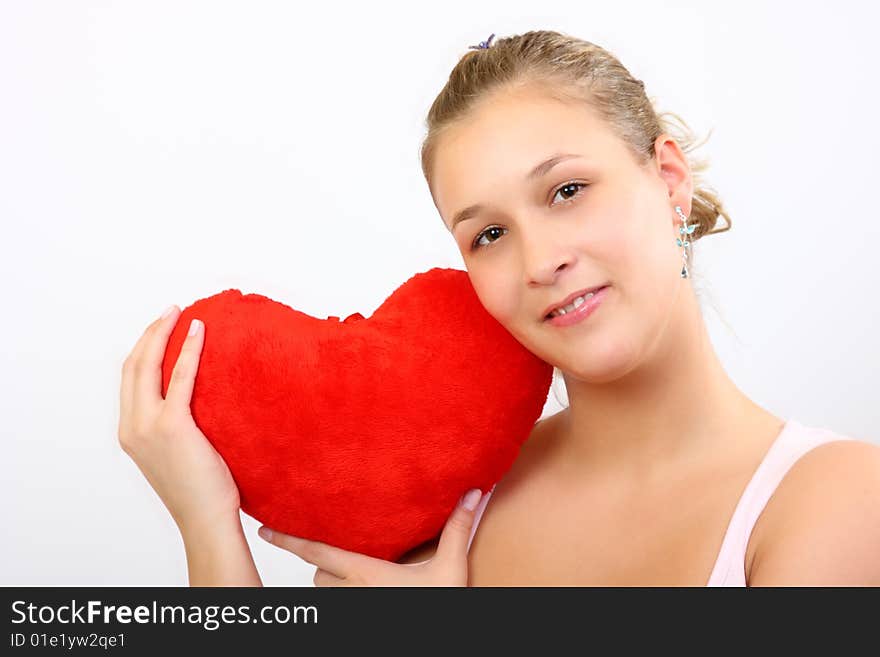 Girl holding a plush heart. Girl holding a plush heart