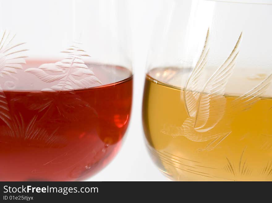 Two crystal wine-glassful with red and white wine