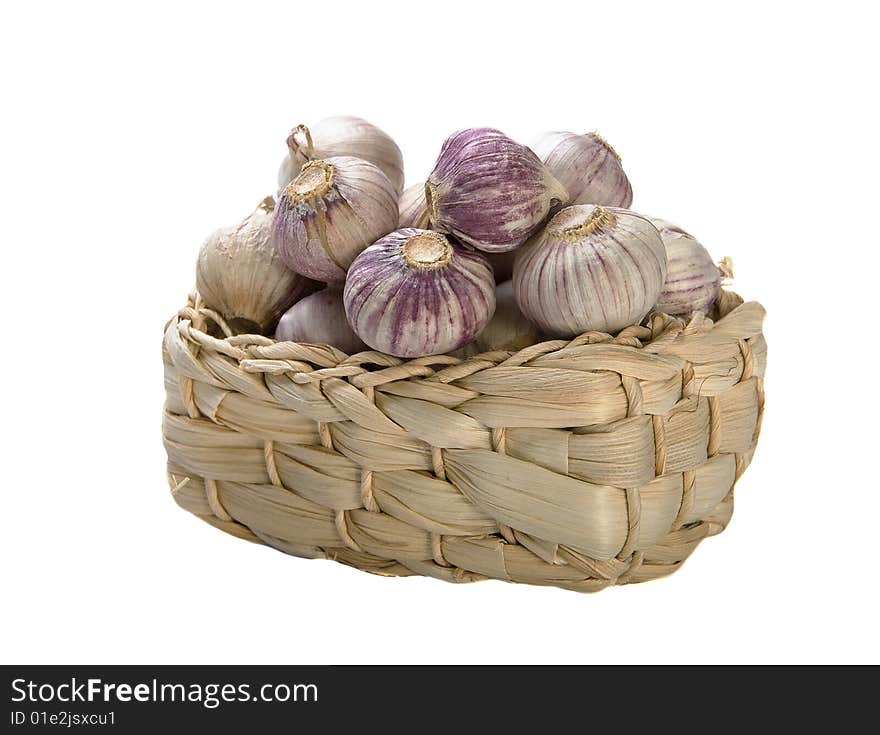 Garlic in basket on white background