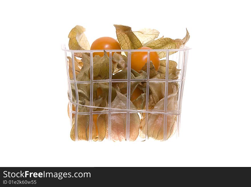 Basket of Phillis fruit isolated on white.