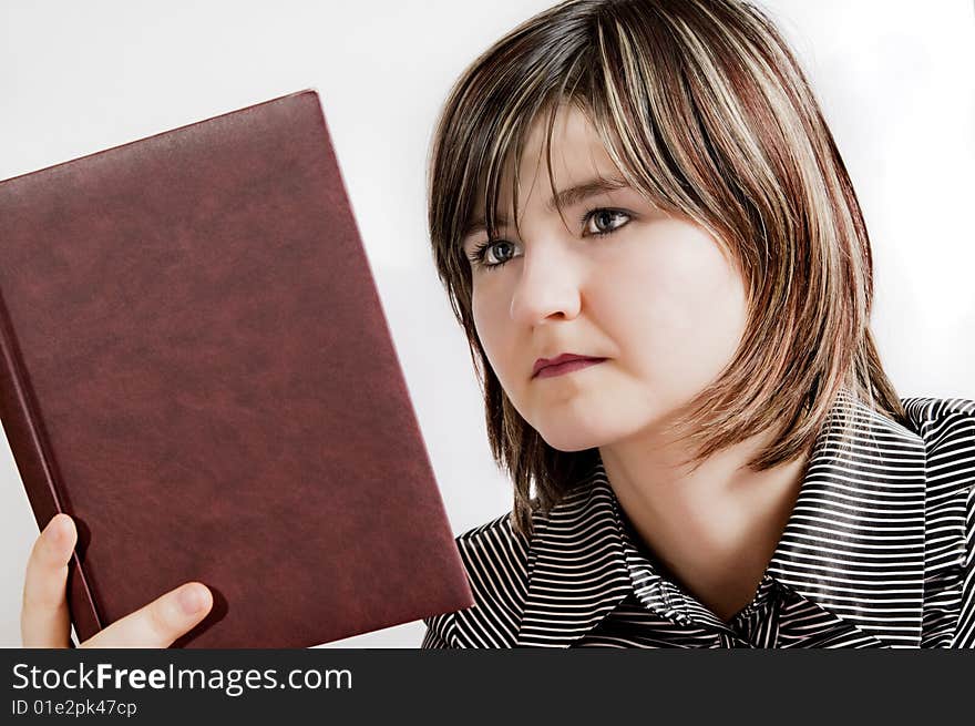 Attractive girl looking in a book