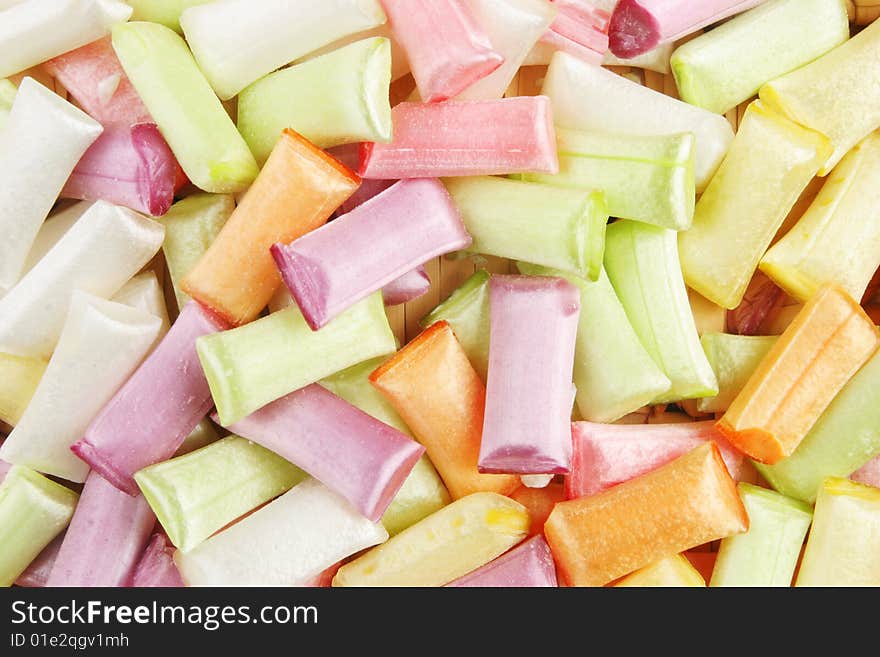 Colorful sherbet straw sweets as a background and texture. Colorful sherbet straw sweets as a background and texture