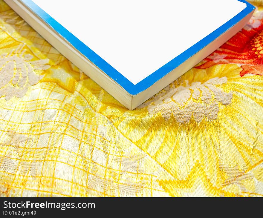 Book on colorful sheets with copy space