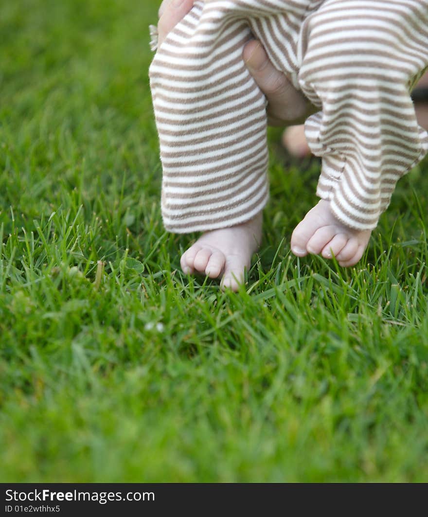 Baby toes in the grass for the first time