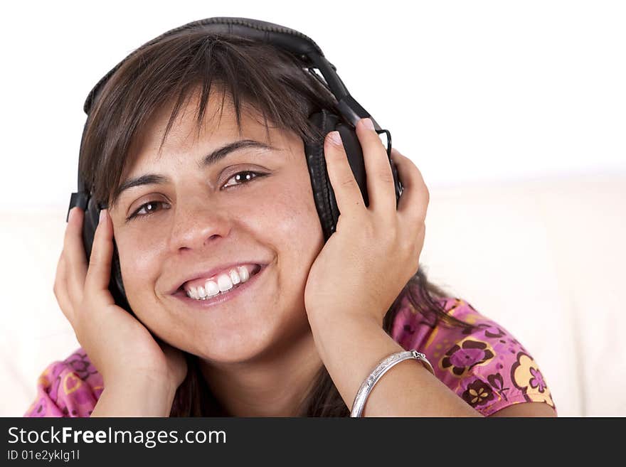 Young teenager smiling with music hearphones. Young teenager smiling with music hearphones