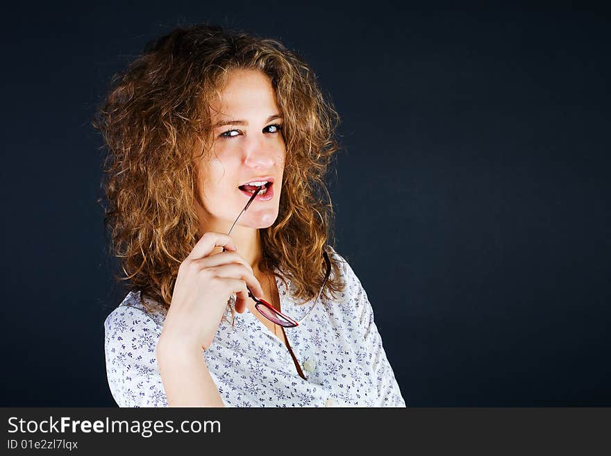 Business women in glasses on black background. Business women in glasses on black background