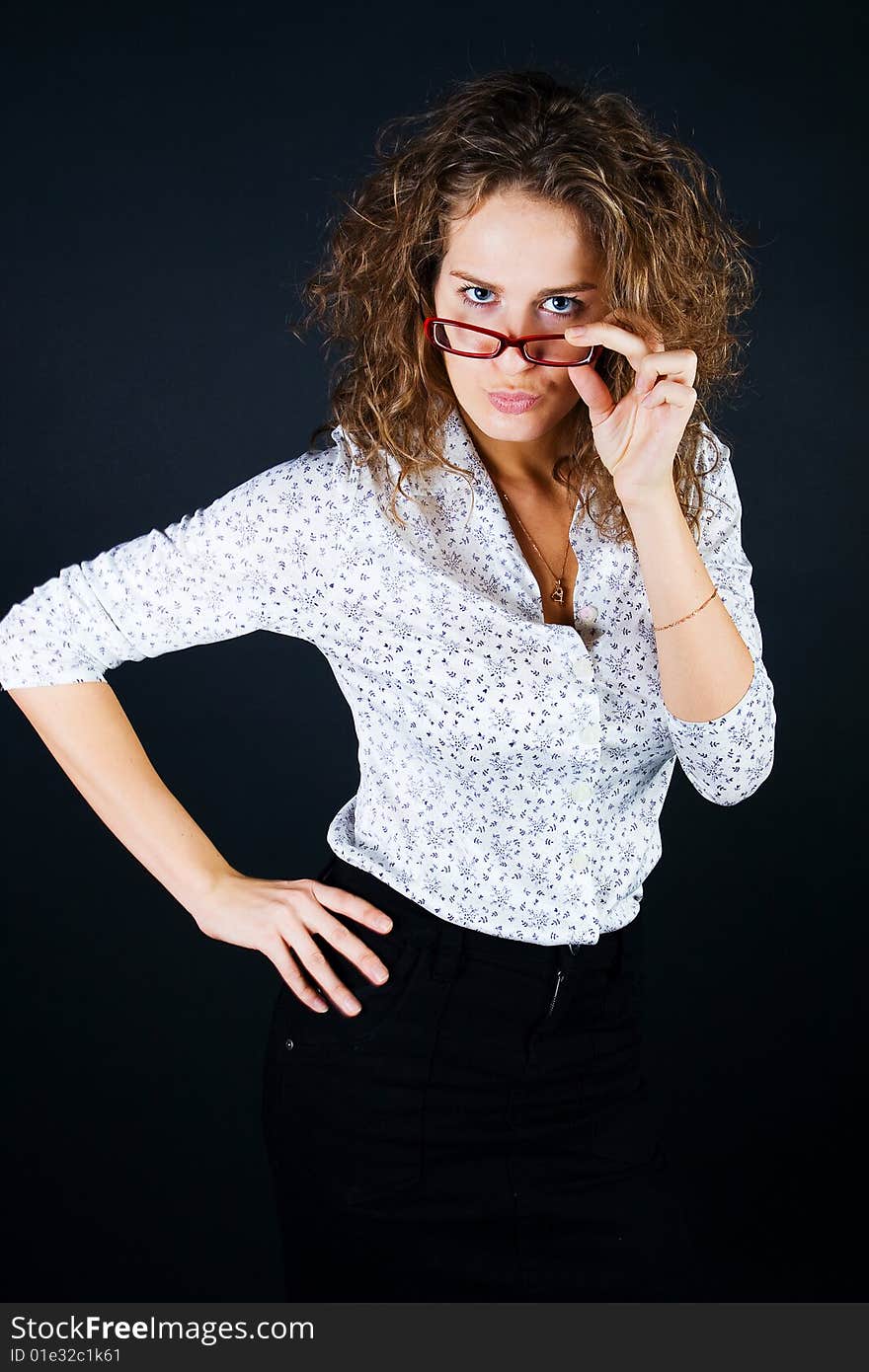 Business women in glasses on black background. Business women in glasses on black background