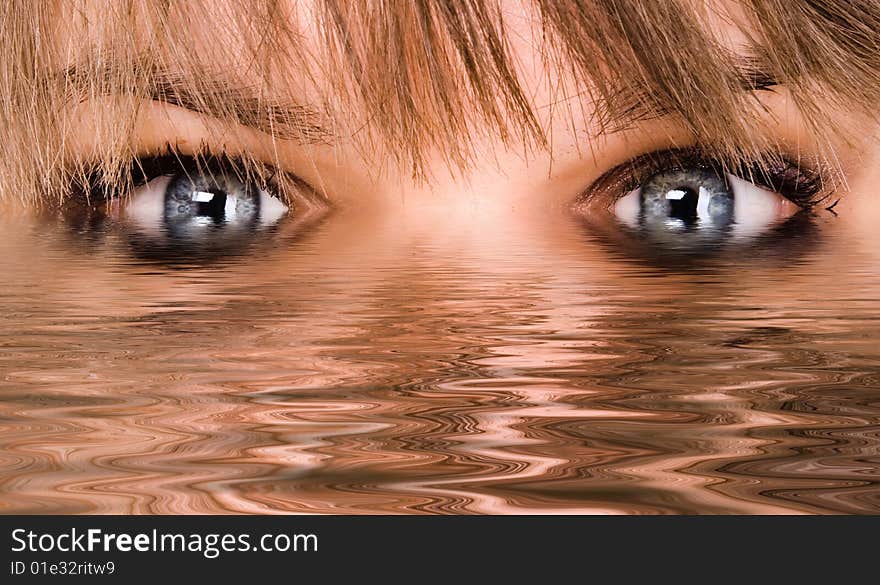 Beautiful woman eyes reflected in the water. Beautiful woman eyes reflected in the water