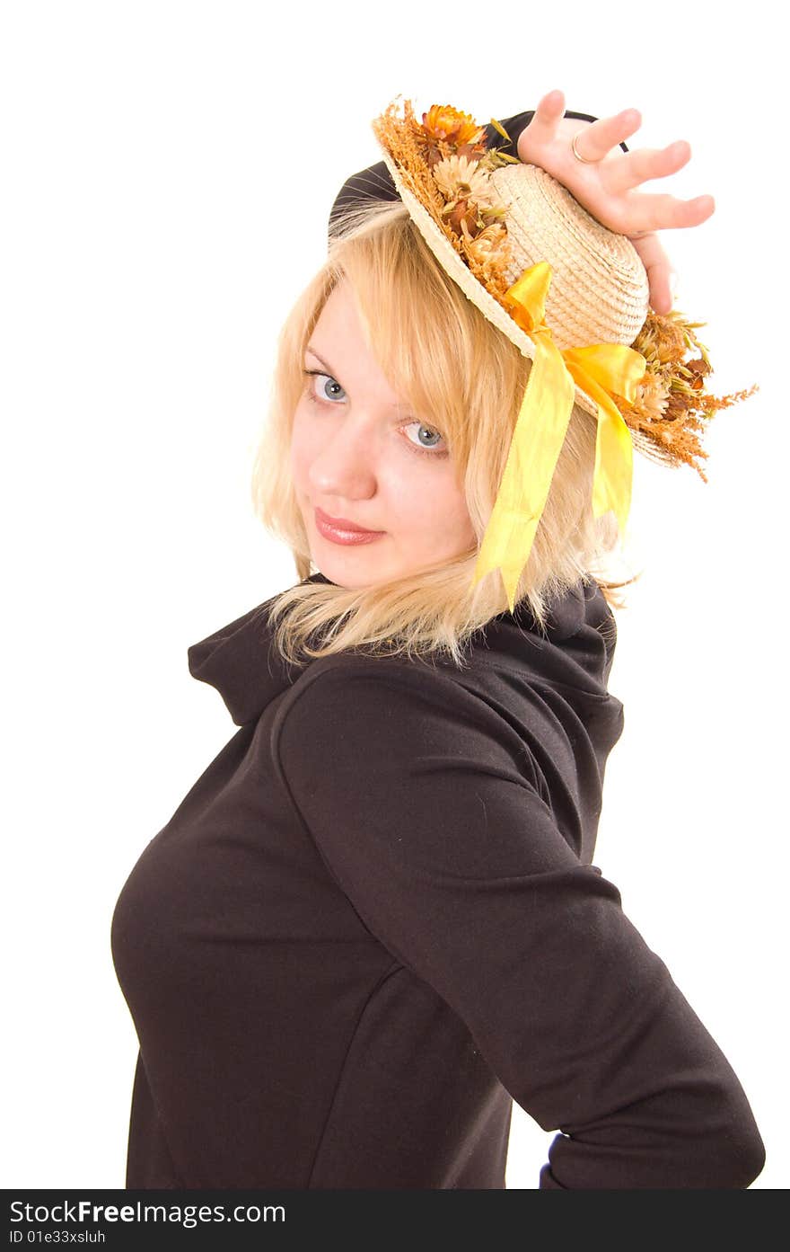 Portrait of young woman in straw hat on white background