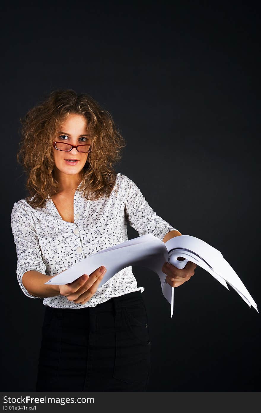 Business women with documents on black background. Business women with documents on black background