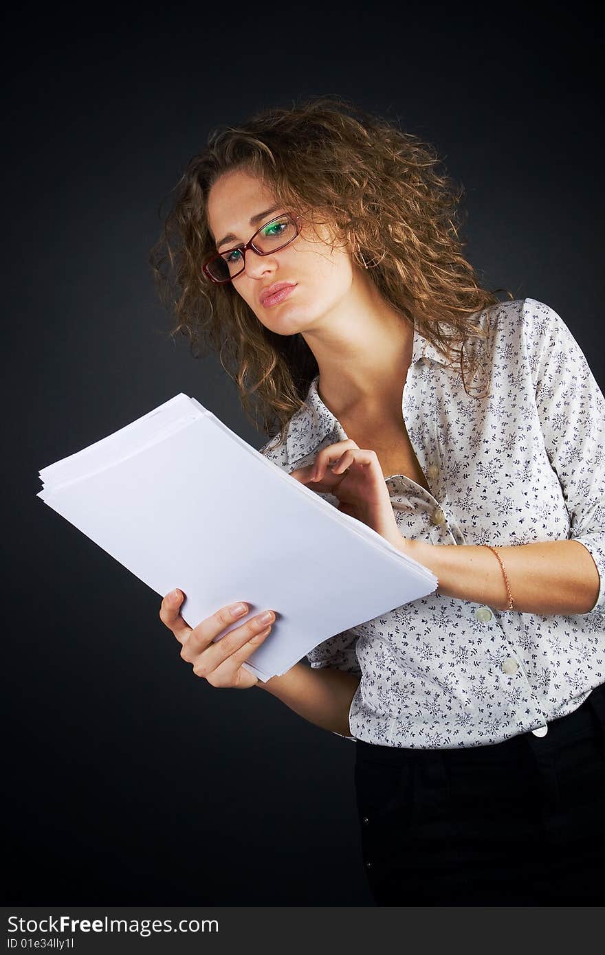 Business women with documents on black background. Business women with documents on black background