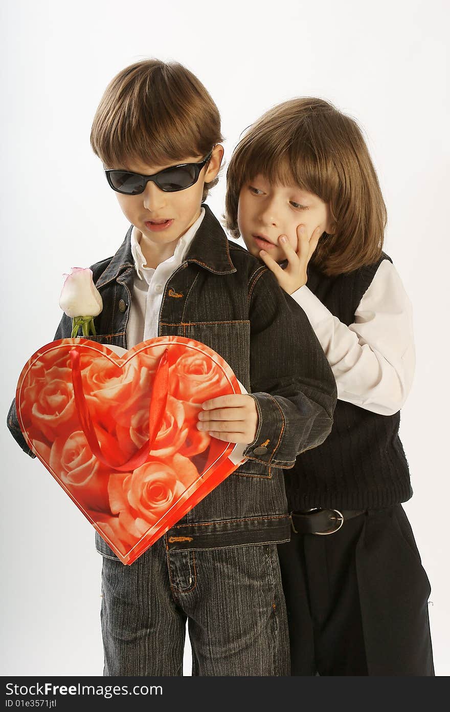 Portrait of two boys considering a gift