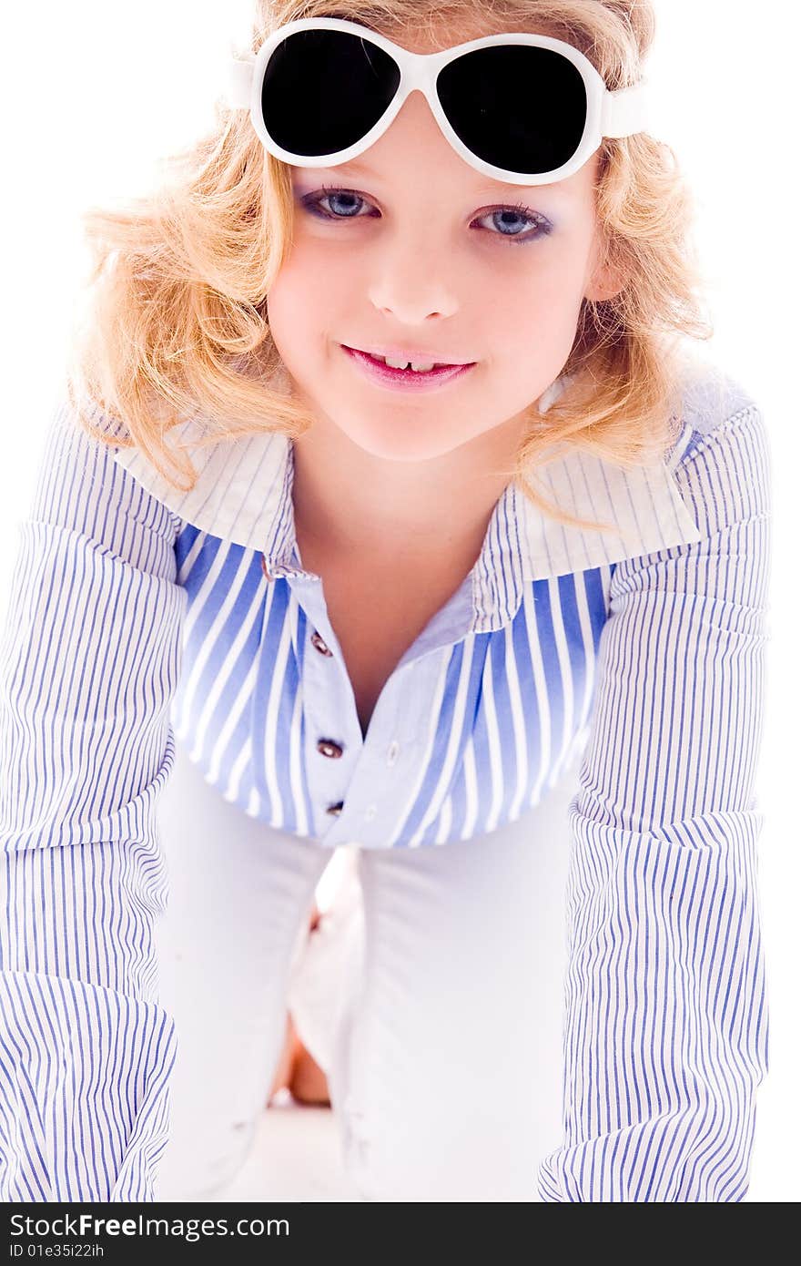 A blue fashion child showing her clothes on white. A blue fashion child showing her clothes on white