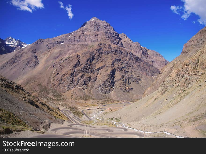 A curved road to cross the Andes mountains.