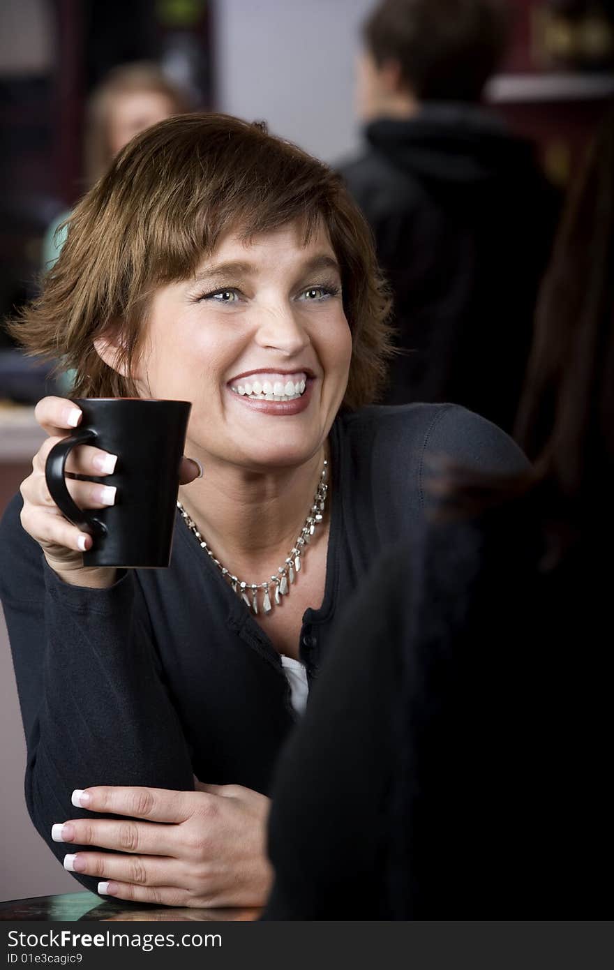 Woman with Friend in Coffee House