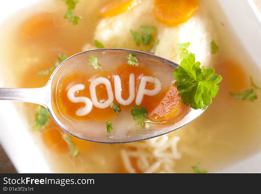 Noodle soup with dumplings and carrots